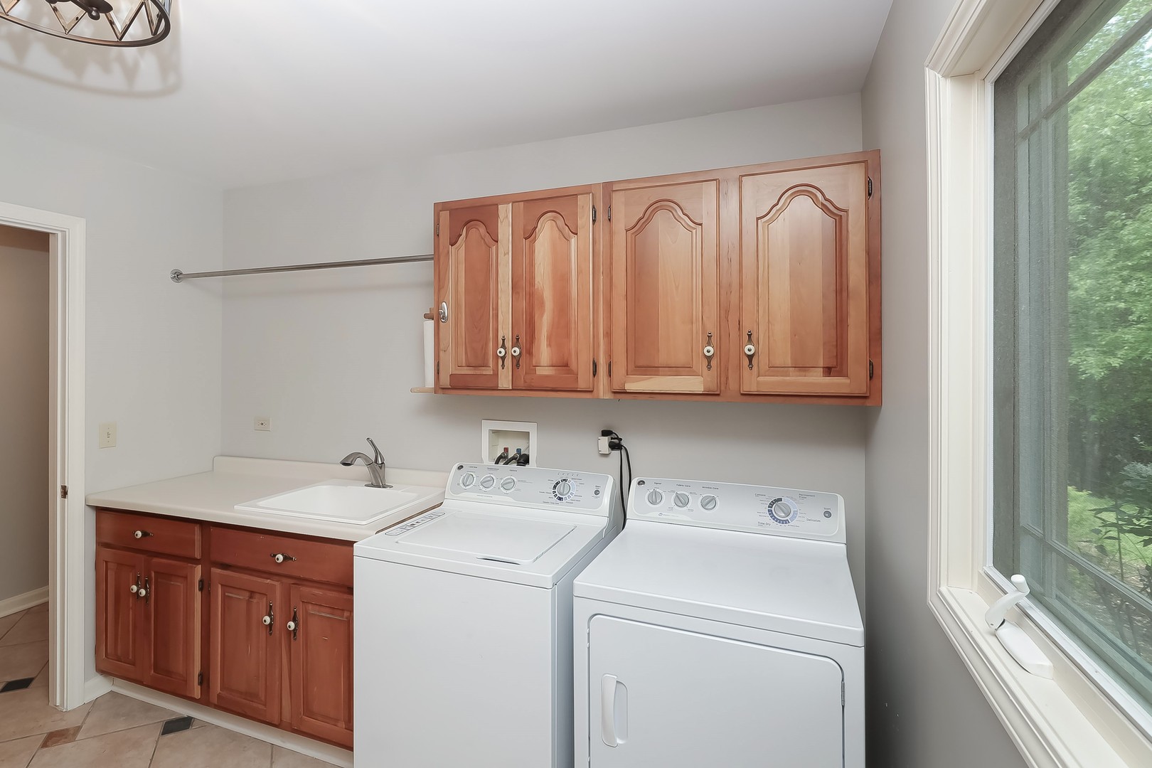 7704 Newbold Road Cary, IL 60013 - Photo 28 of 56 a view of a storage and utility room with washer and dryer
