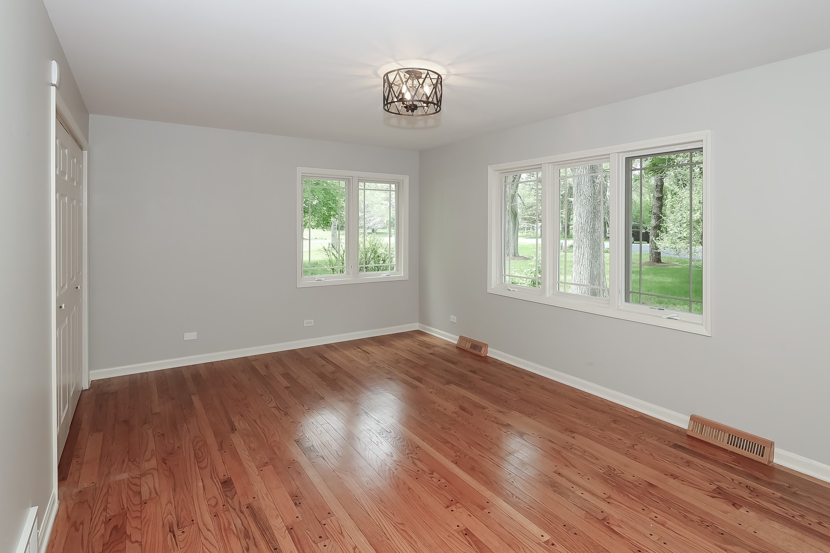 7704 Newbold Road Cary, IL 60013 - Photo 31 of 56 a view of an empty room with wooden floor and a window