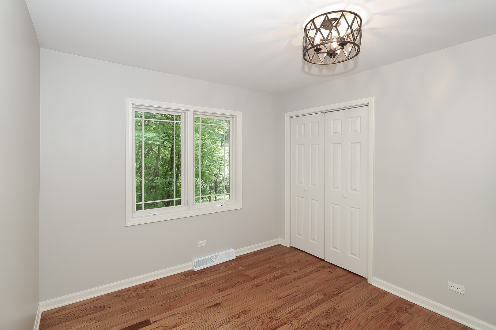 7704 Newbold Road Cary, IL 60013 - Photo 33 of 56 an empty room with a wooden floor