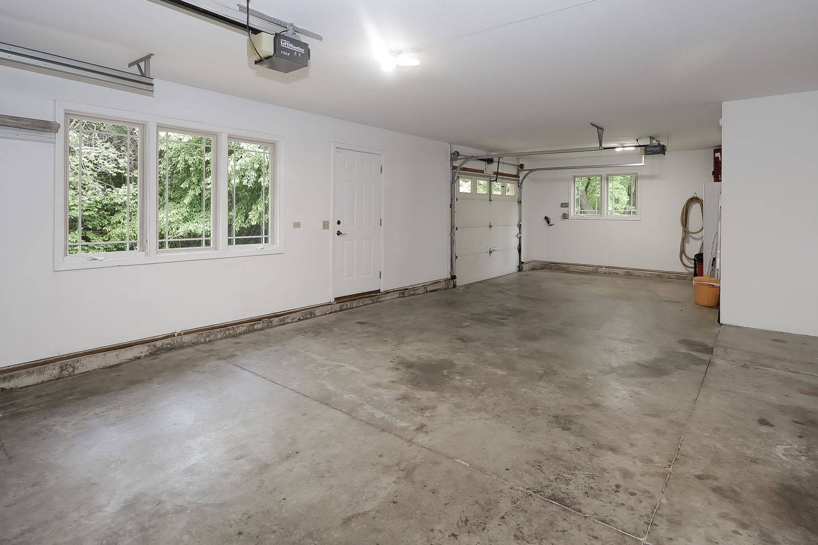 7704 Newbold Road Cary, IL 60013 - Photo 39 of 56 en empty room with windows and refrigerator