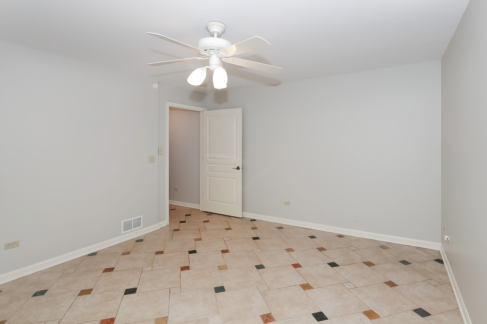 7704 Newbold Road Cary, IL 60013 - Photo 9 of 56 an empty room with a chandelier fan and closet area