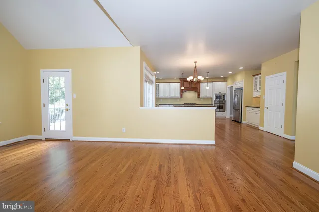 a view of a kitchen with a wooden floor