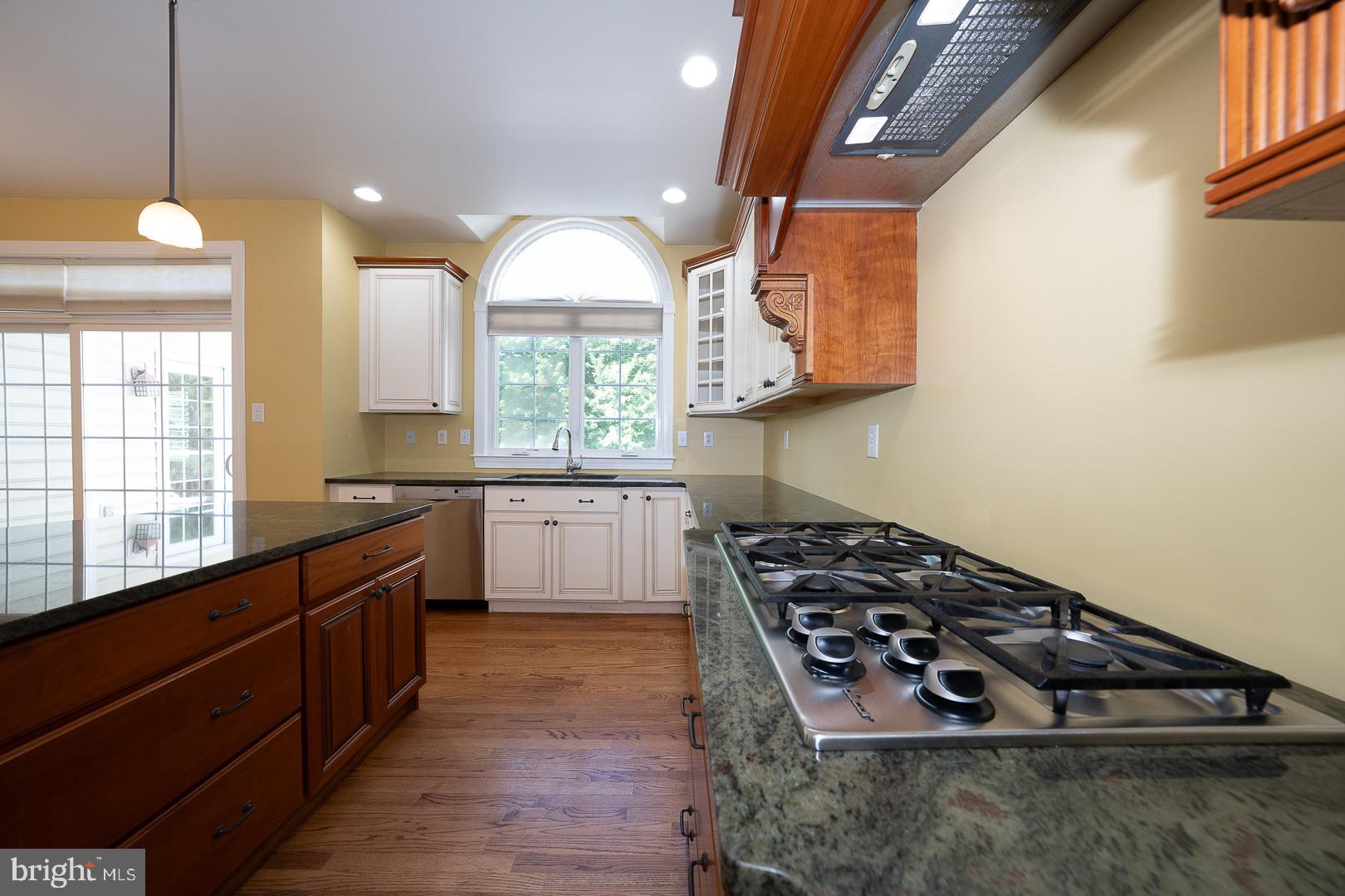 2140 Howell Road Malvern, PA 19355 - Photo 20 of 47 a kitchen with wooden cabinets and a stove
