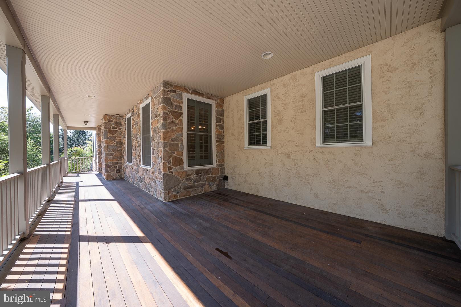 2140 Howell Road Malvern, PA 19355 - Photo 2 of 47 a view of balcony with wooden floor and floor to ceiling window