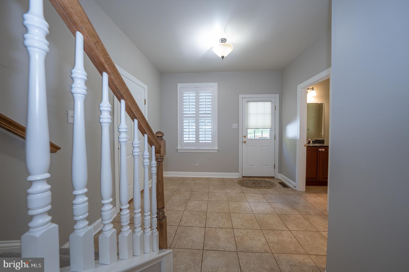 2140 Howell Road Malvern, PA 19355 - Photo 23 of 47 a view of an entryway with wooden floor and windows