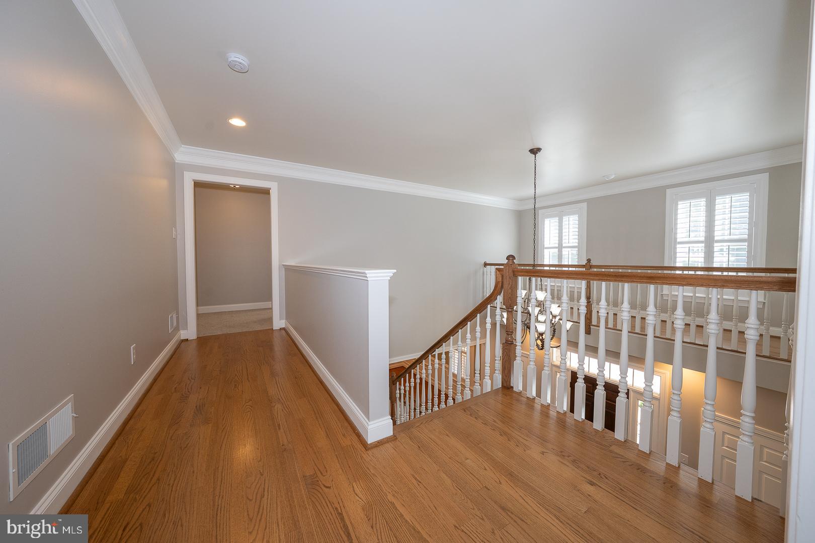 2140 Howell Road Malvern, PA 19355 - Photo 27 of 47 a view of a hallway with wooden floor and stairs