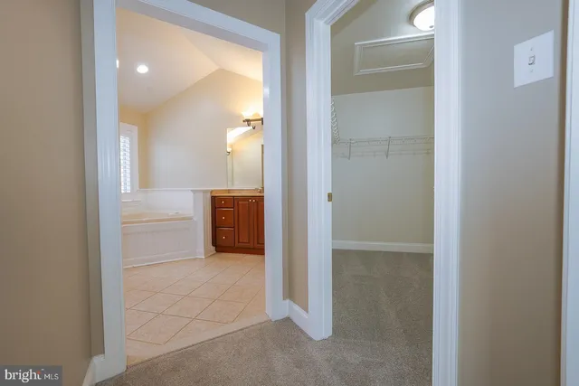 a bathroom with bathtub and window