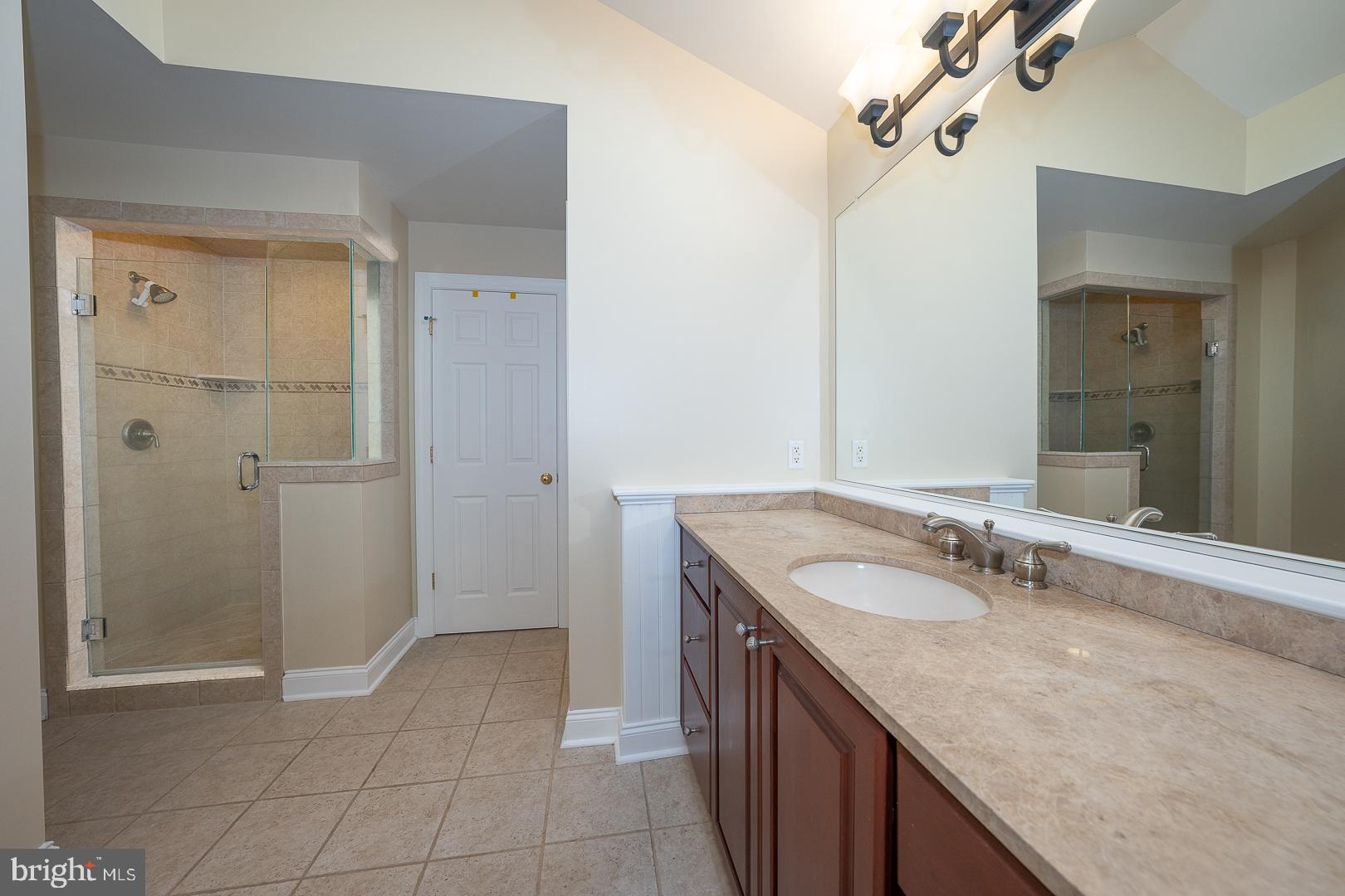 2140 Howell Road Malvern, PA 19355 - Photo 35 of 47 a bathroom with a granite countertop sink and a mirror