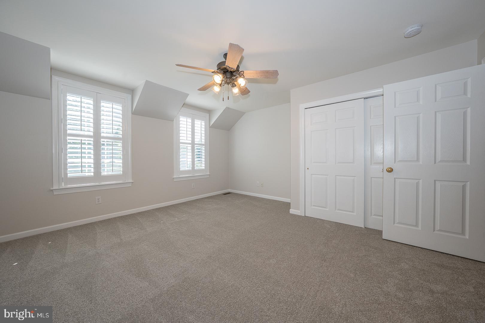 2140 Howell Road Malvern, PA 19355 - Photo 37 of 47 an empty room with windows and fan