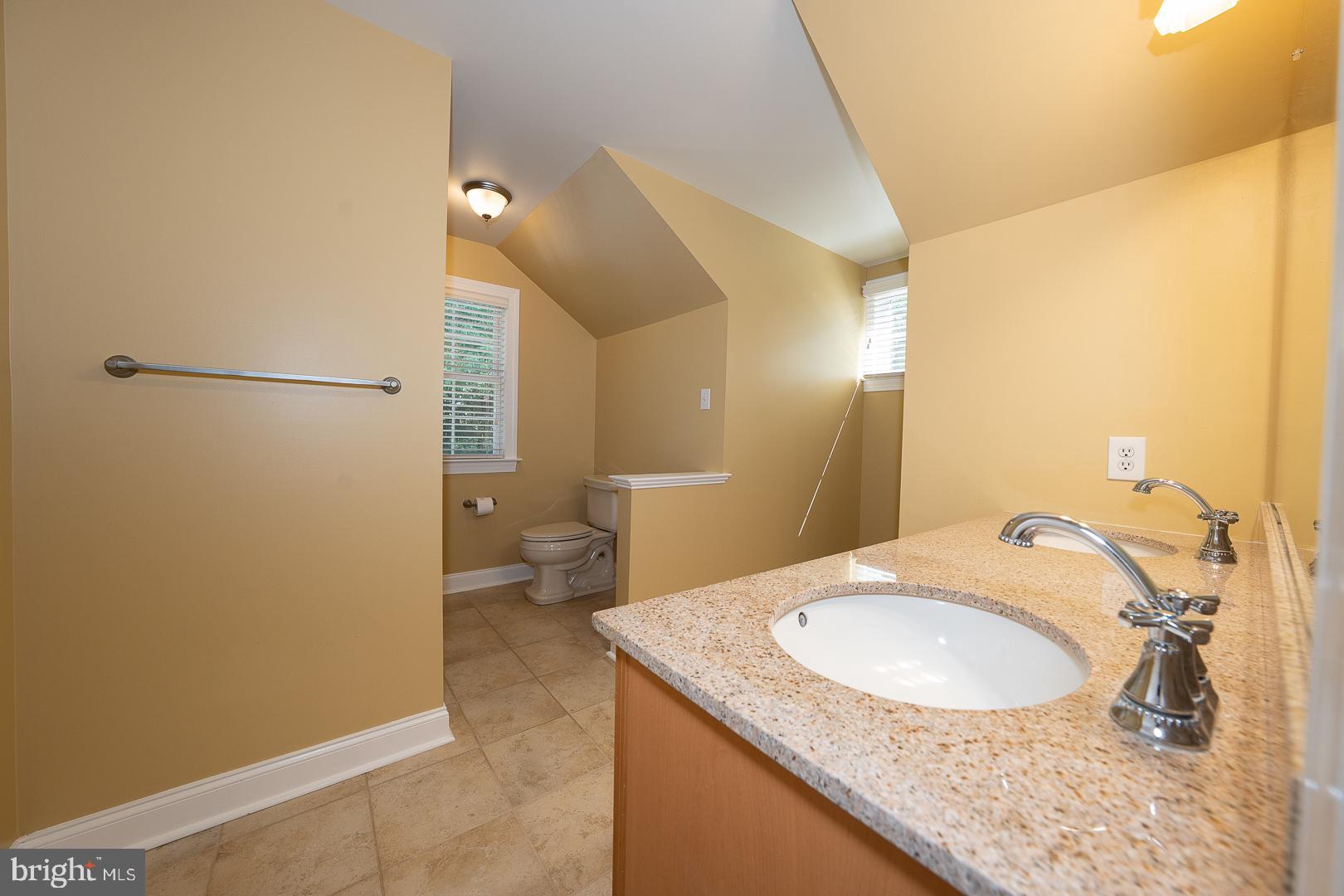 2140 Howell Road Malvern, PA 19355 - Photo 40 of 47 a bathroom with a granite countertop sink and a mirror