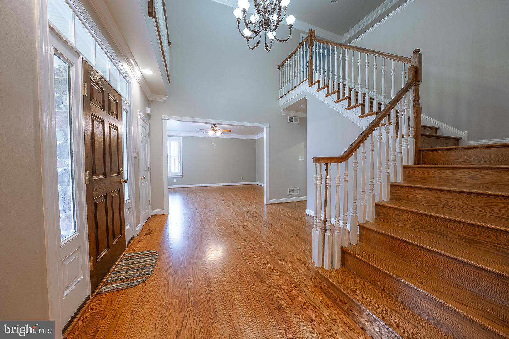 2140 Howell Road Malvern, PA 19355 - Photo 4 of 47 a view of staircase with wooden floor and a chandelier