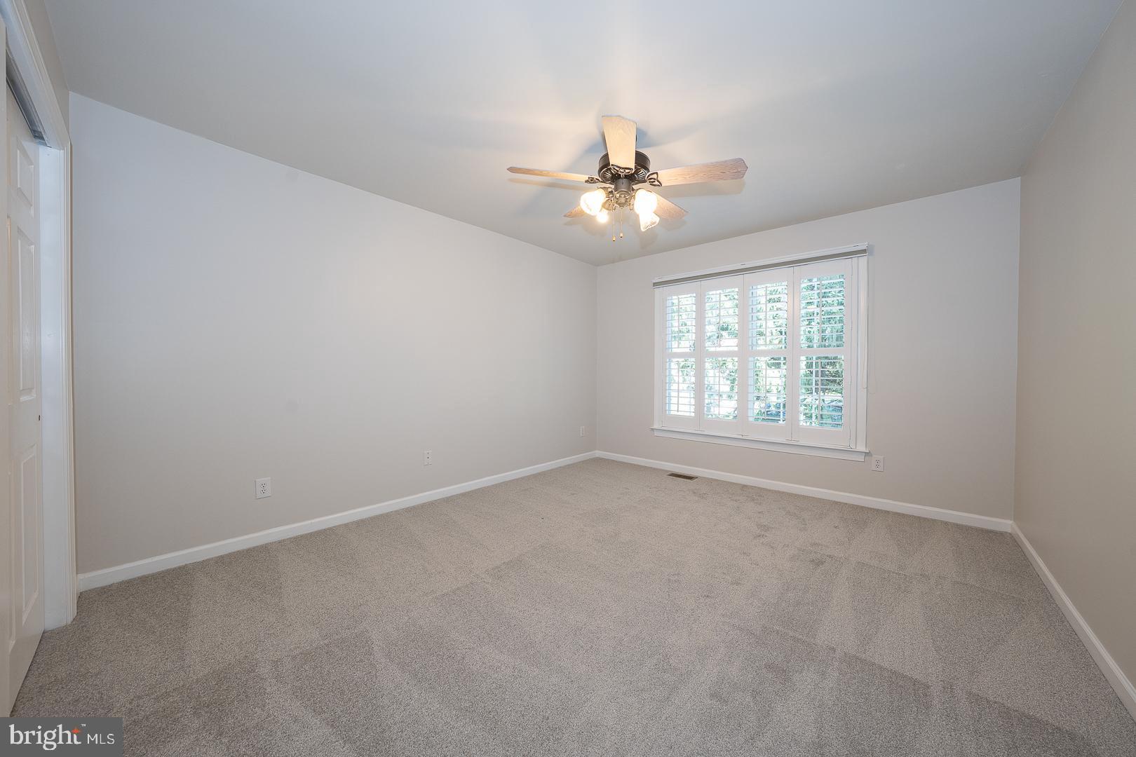 2140 Howell Road Malvern, PA 19355 - Photo 43 of 47 an empty room with a window and a fan