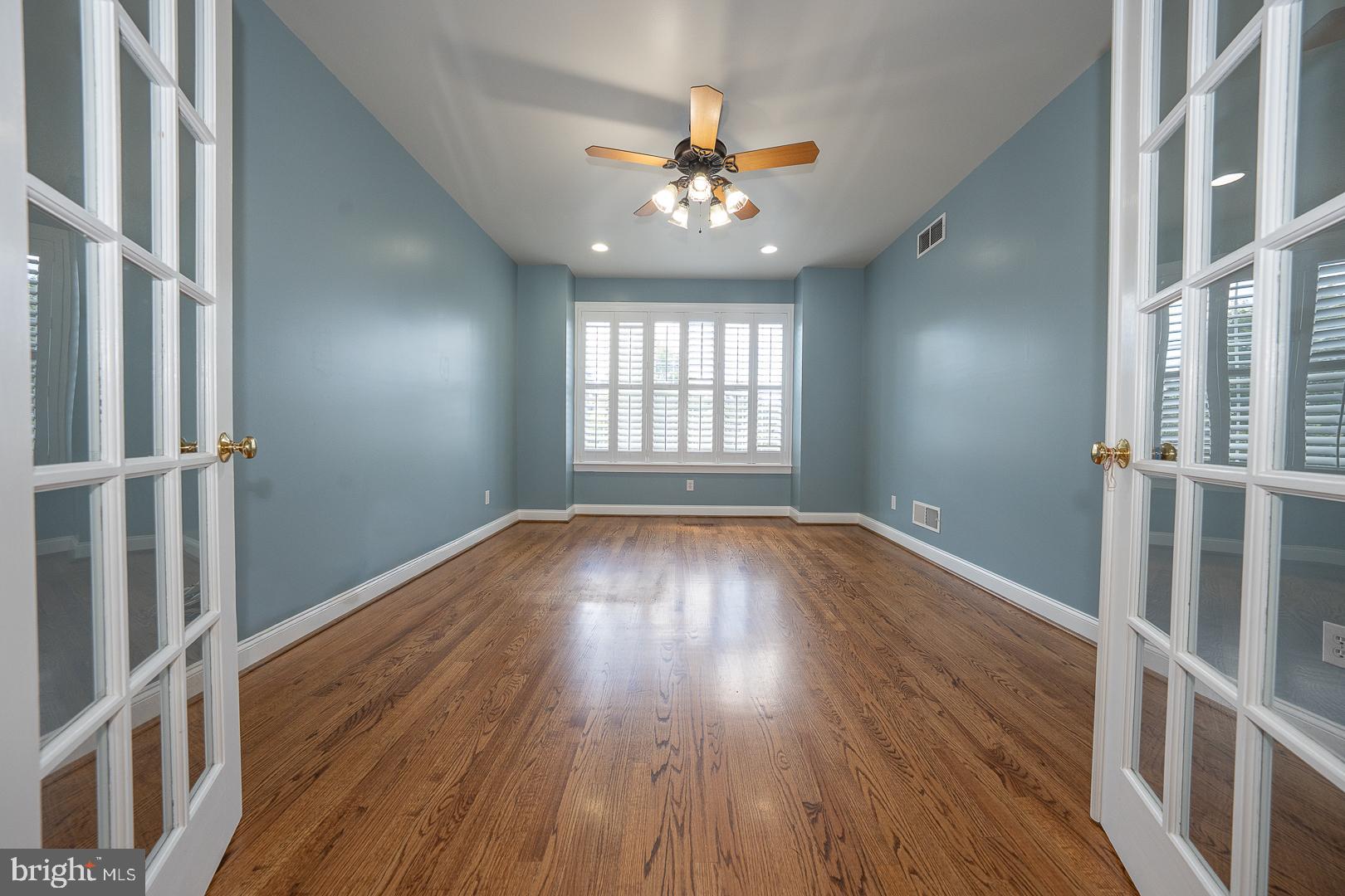 2140 Howell Road Malvern, PA 19355 - Photo 8 of 47 a view of an empty room with wooden floor and a window