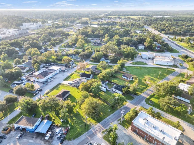 an aerial view of residential houses with outdoor space