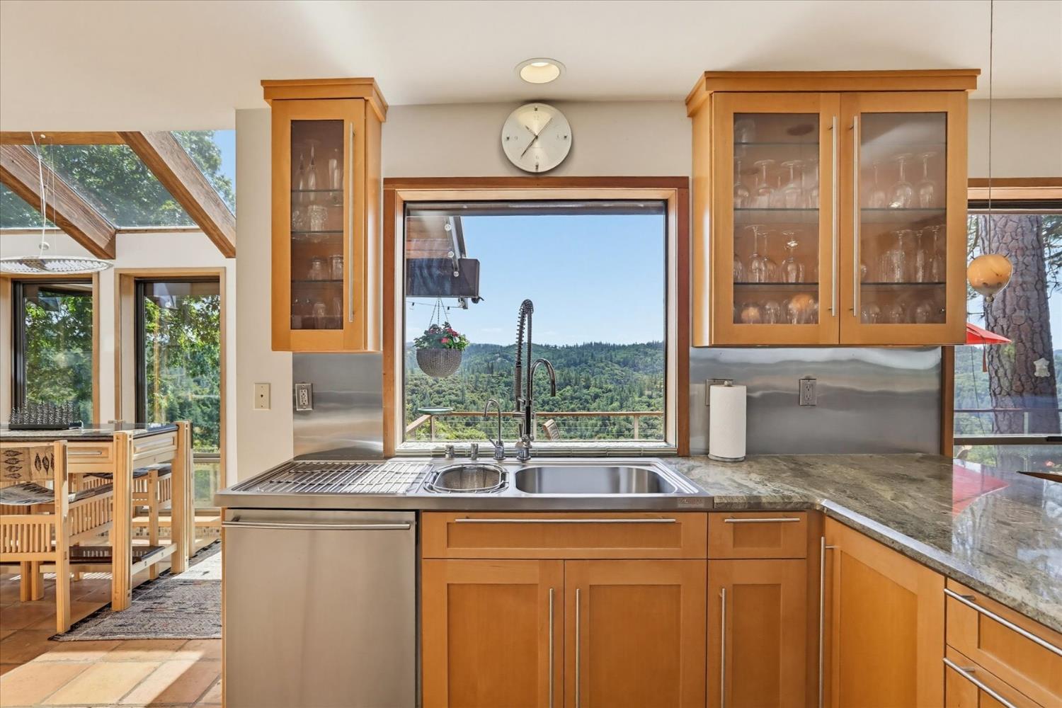 20111 Tanglewood Road Grass Valley, CA 95945 - Photo 16 of 93 a kitchen with a window a sink and cabinets