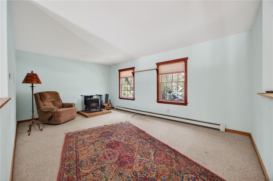 1936 Briggs Road Benton, NY 14527 - Photo 5 of 44 Living room has a wood stove