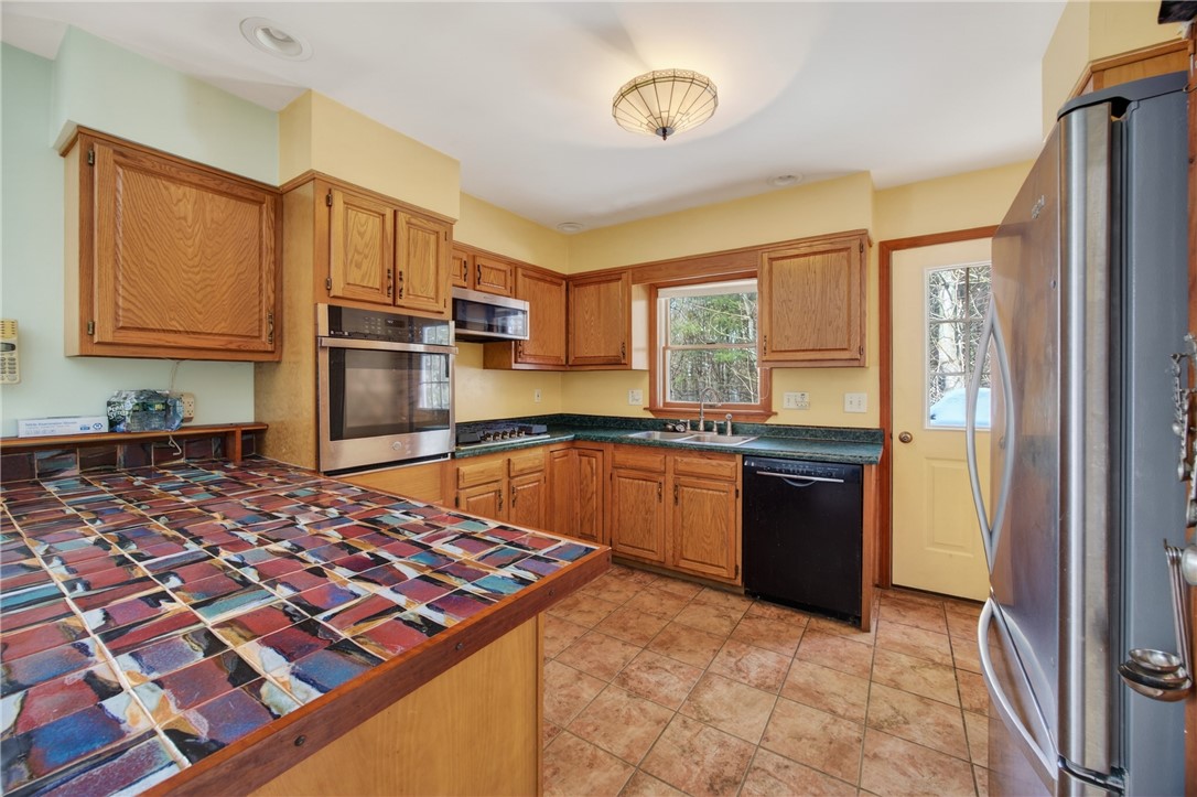 1936 Briggs Road Benton, NY 14527 - Photo 9 of 44 Island has custom artist tiles