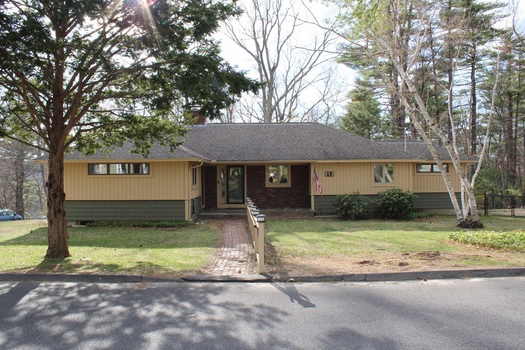 14 Crest Road Monson, MA 01057 - Photo 1 of 35 a front view of a house with a yard and garage