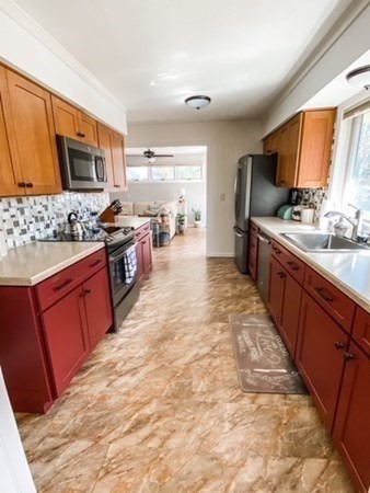 14 Crest Road Monson, MA 01057 - Photo 11 of 35 a large kitchen with stainless steel appliances granite countertop a stove a sink dishwasher and a refrigerator