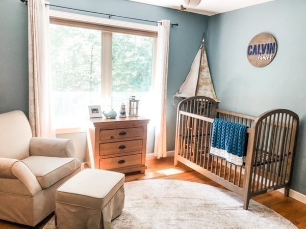 14 Crest Road Monson, MA 01057 - Photo 22 of 35 a living room with furniture a baby crib and a window