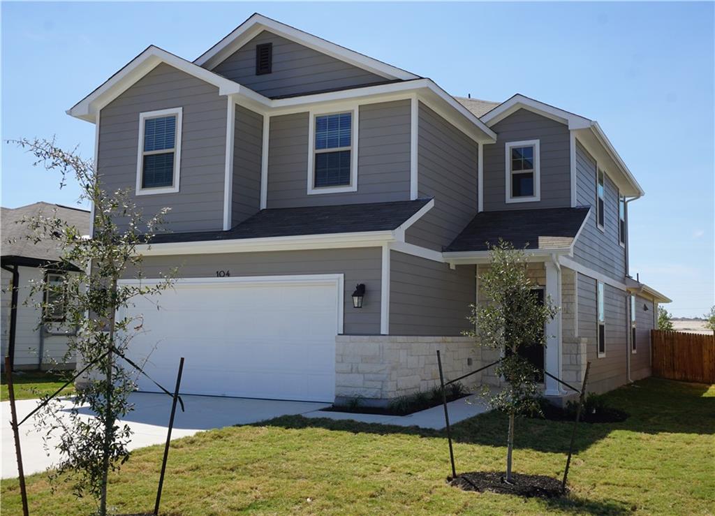 Contemporary two-story exterior with gray siding and white trim