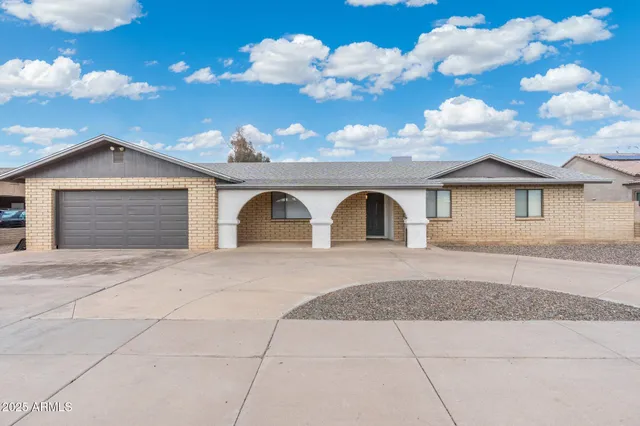 a front view of a house with lots of yellow lighting
