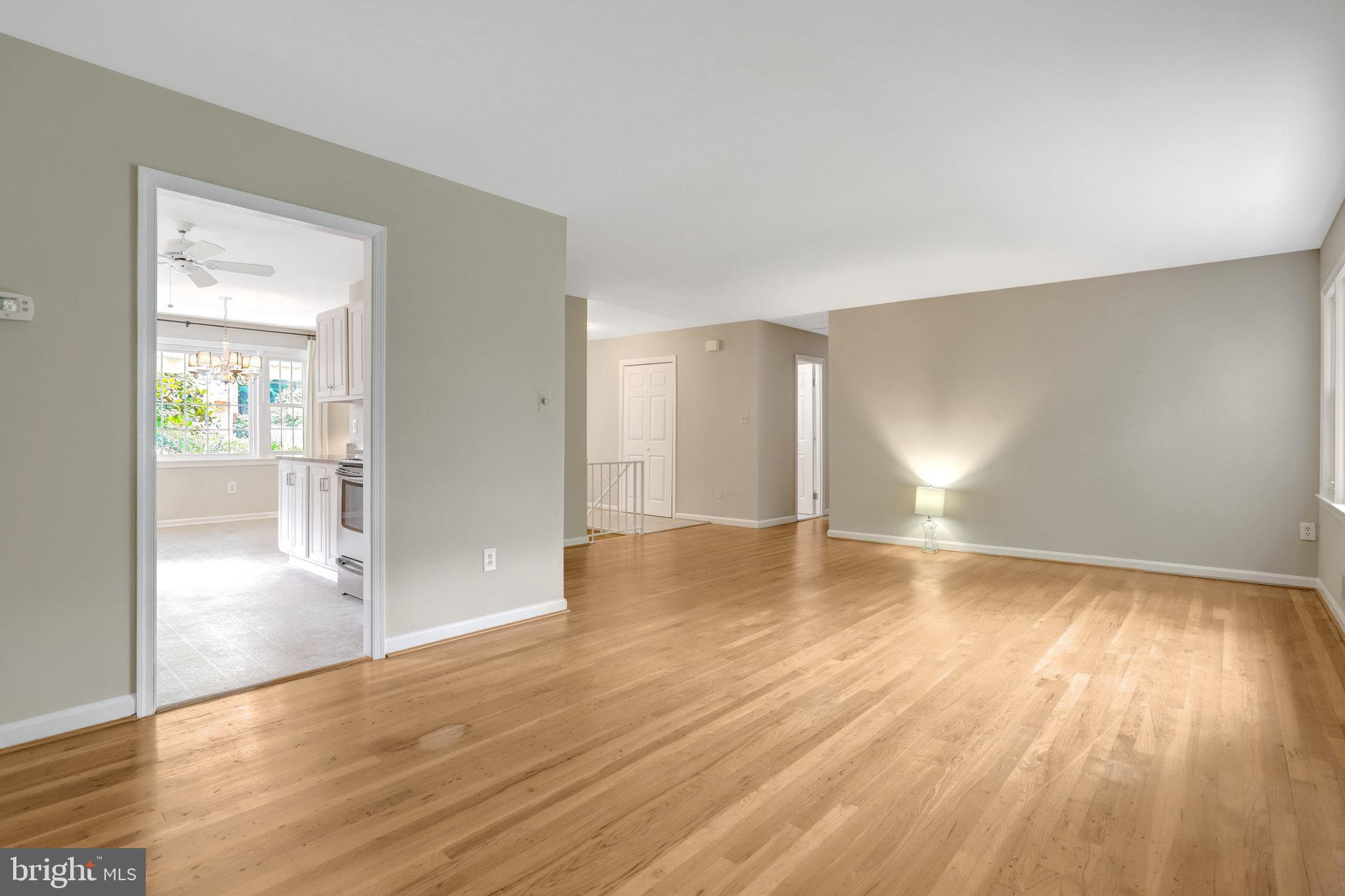 8706 Fox Ridge Road Springfield, VA 22152 - Photo 18 of 76 wooden floor in an empty room with a window