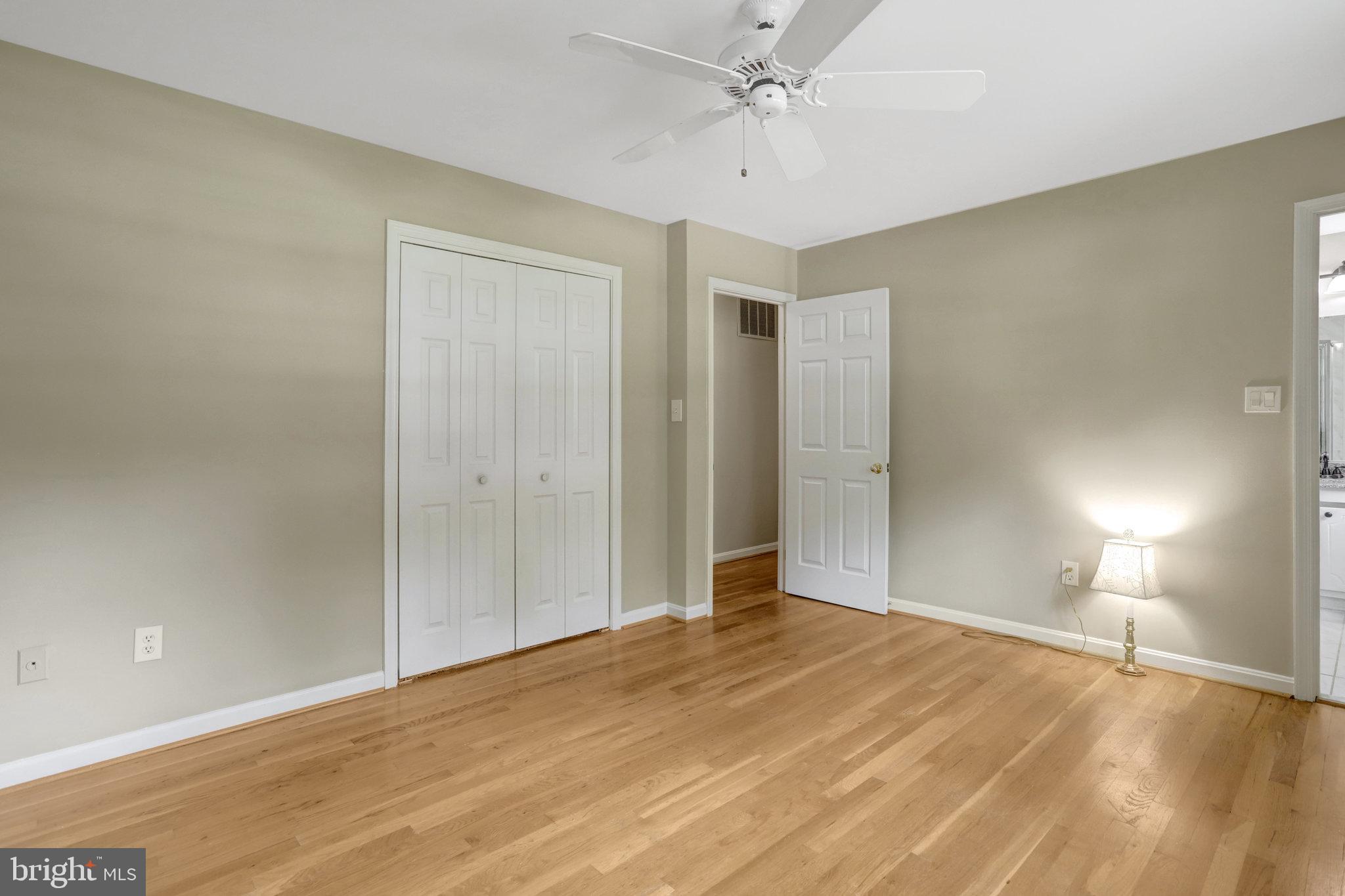 8706 Fox Ridge Road Springfield, VA 22152 - Photo 27 of 76 a view of empty room with window and ceiling fan