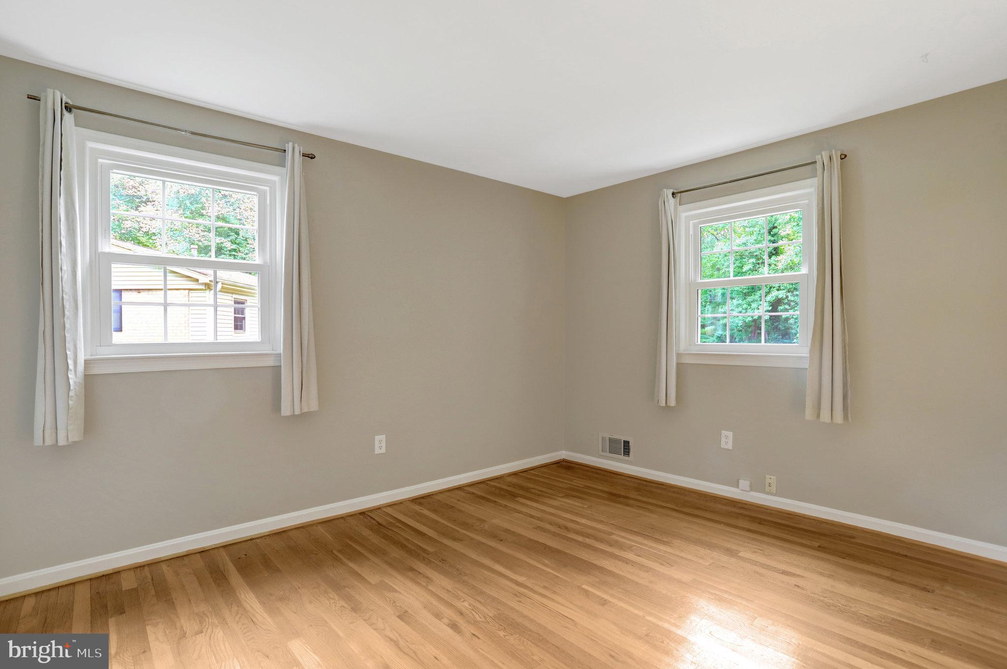 8706 Fox Ridge Road Springfield, VA 22152 - Photo 32 of 76 a view of empty room with wooden floor