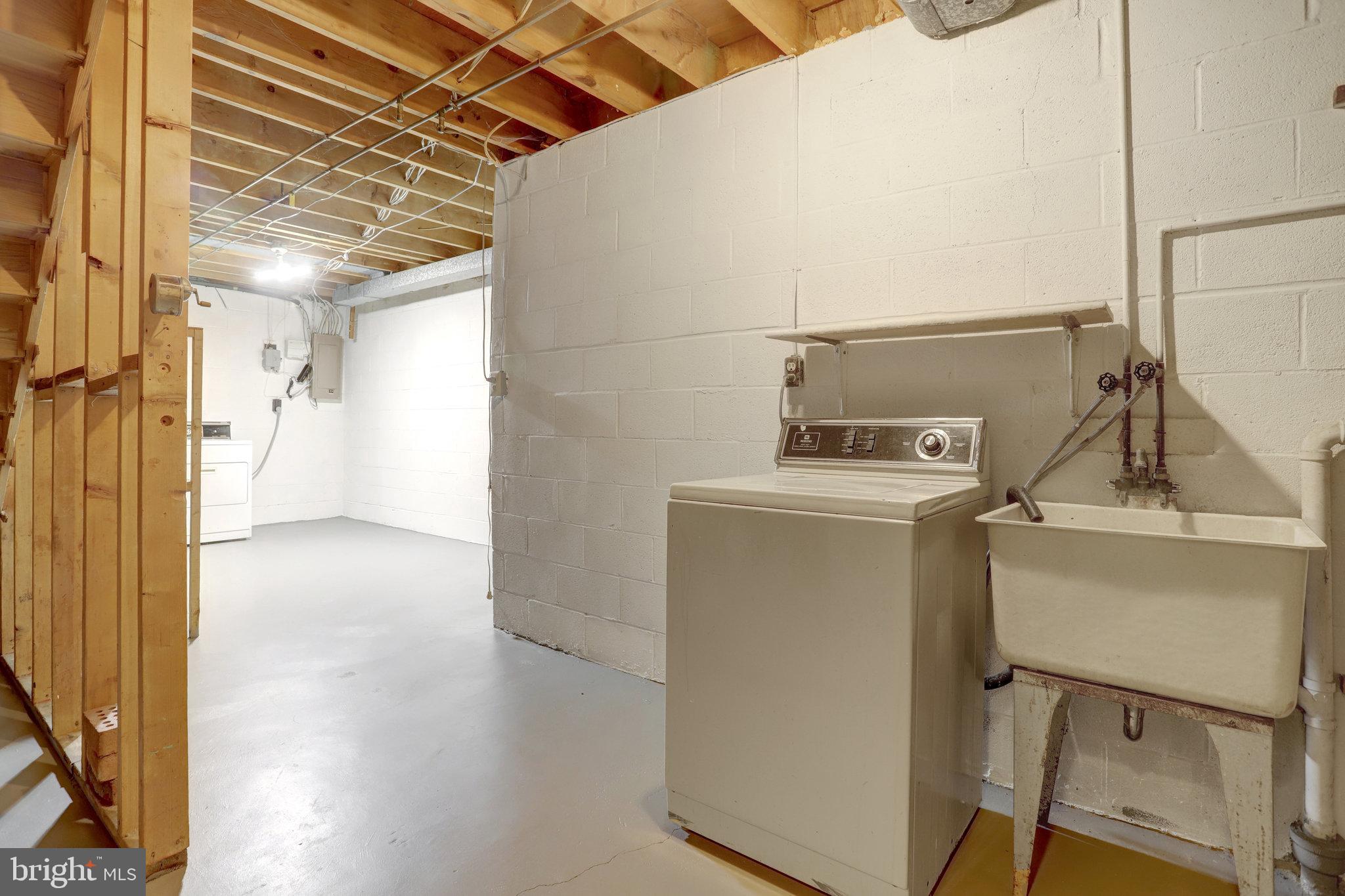 8706 Fox Ridge Road Springfield, VA 22152 - Photo 59 of 76 a utility room with dryer and washer