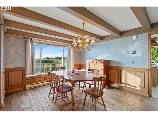 a dining room with furniture and wooden floor