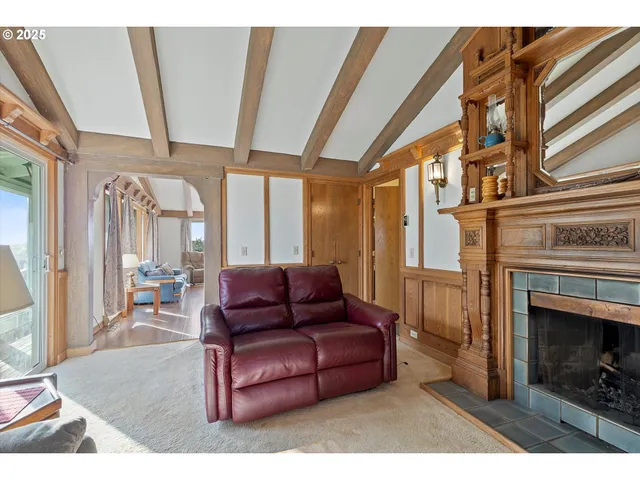 a bedroom with a bed and dresser with mirror