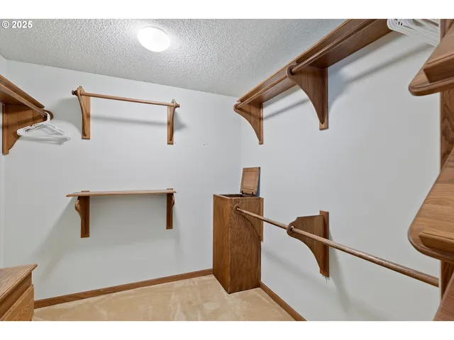 a bathroom with a granite countertop sink a mirror and a bathtub