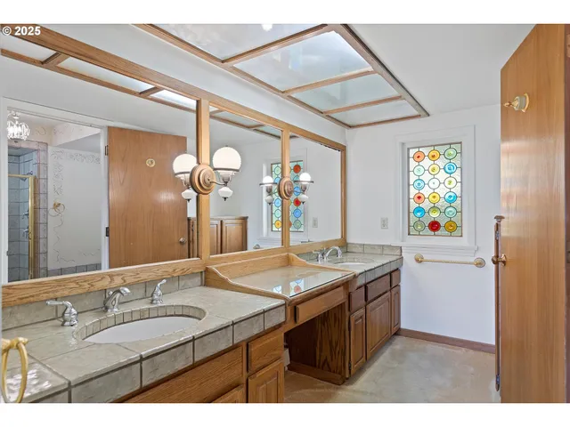 a bathroom with a bathtub and shower