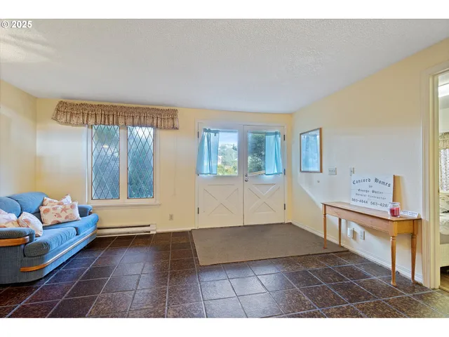 a view of a livingroom with furniture and stairs