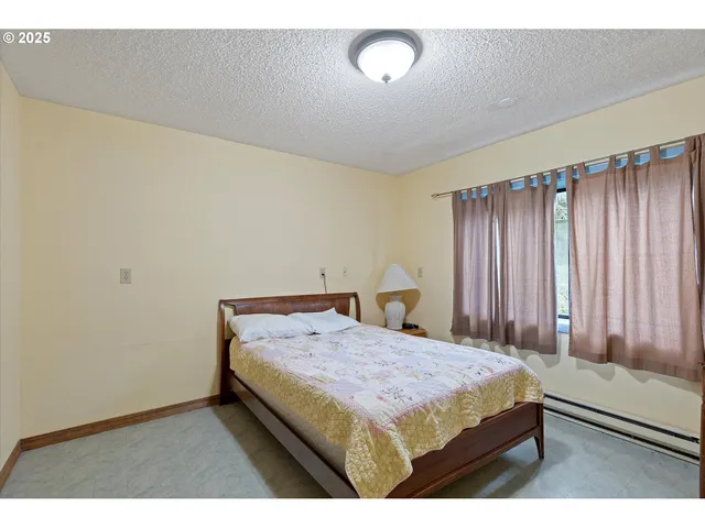 a view of wooden floor and chairs in a room