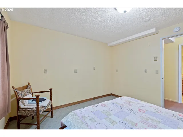 a bathroom with a sink a toilet a mirror and shower