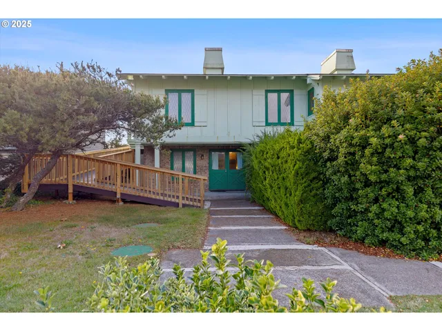 a view of a house with brick walls