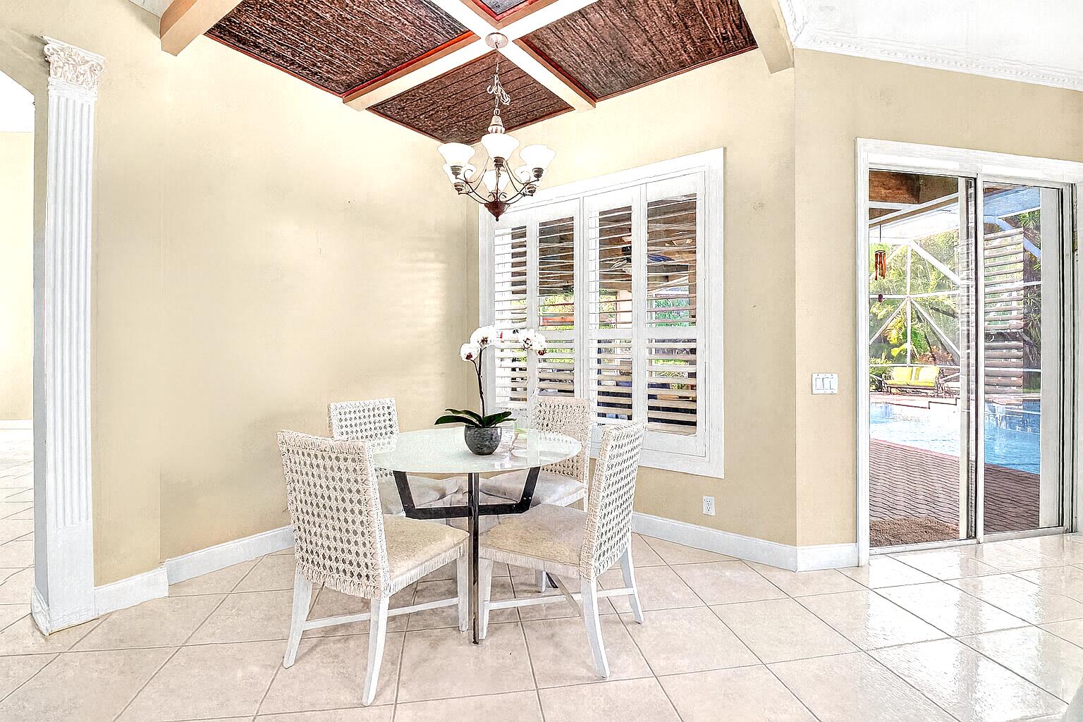 6695 Conch Court Boynton Beach, FL 33437 - Photo 14 of 40 Breakfast Nook with Orchid