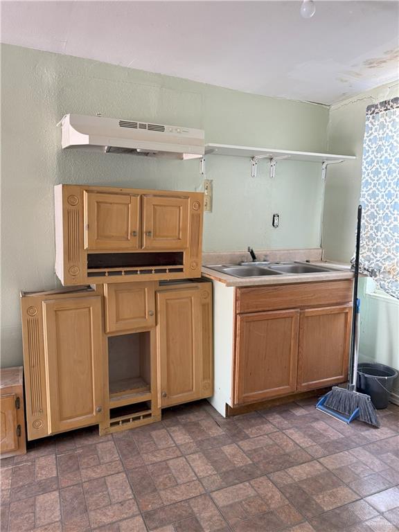 353 East Dicker Road Pharr, TX 78577 - Photo 11 of 32 a kitchen with granite countertop a sink and a stove