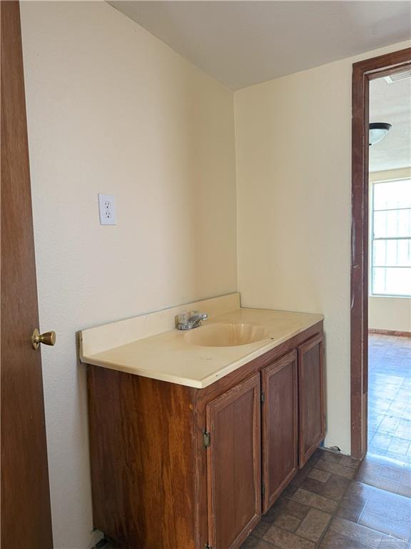 353 East Dicker Road Pharr, TX 78577 - Photo 23 of 32 a bathroom with a sink and a mirror