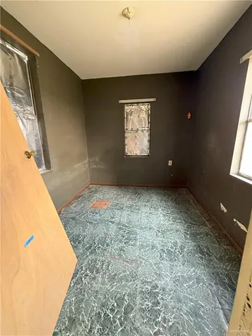 a view of an empty room and window