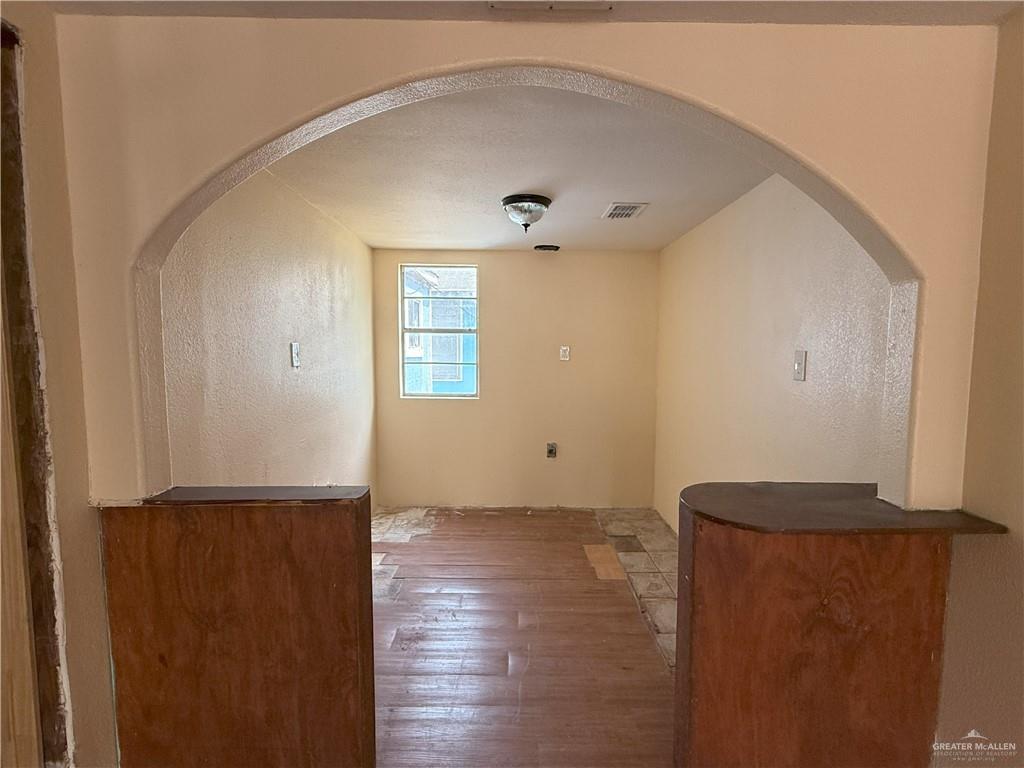 353 East Dicker Road Pharr, TX 78577 - Photo 3 of 32 a view of hallway with wooden floor