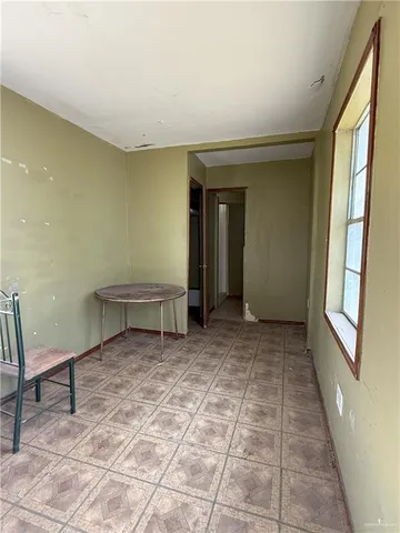 a room with a table and a window