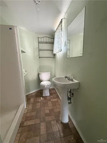 a bathroom with a toilet and a sink