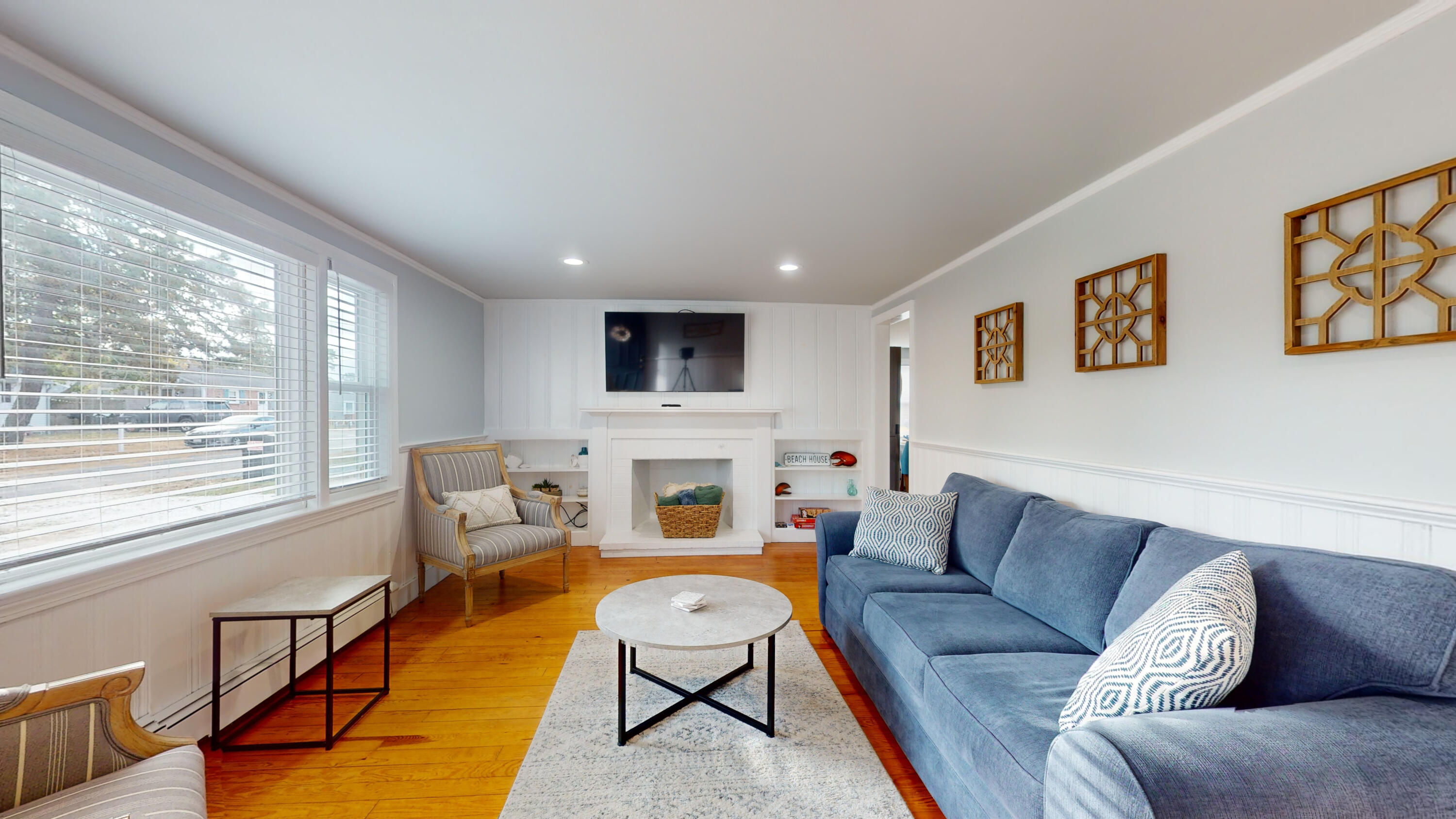 27 Wixon Road Dennis Port, MA 02639 - Photo 11 of 29 a living room with furniture and a fireplace