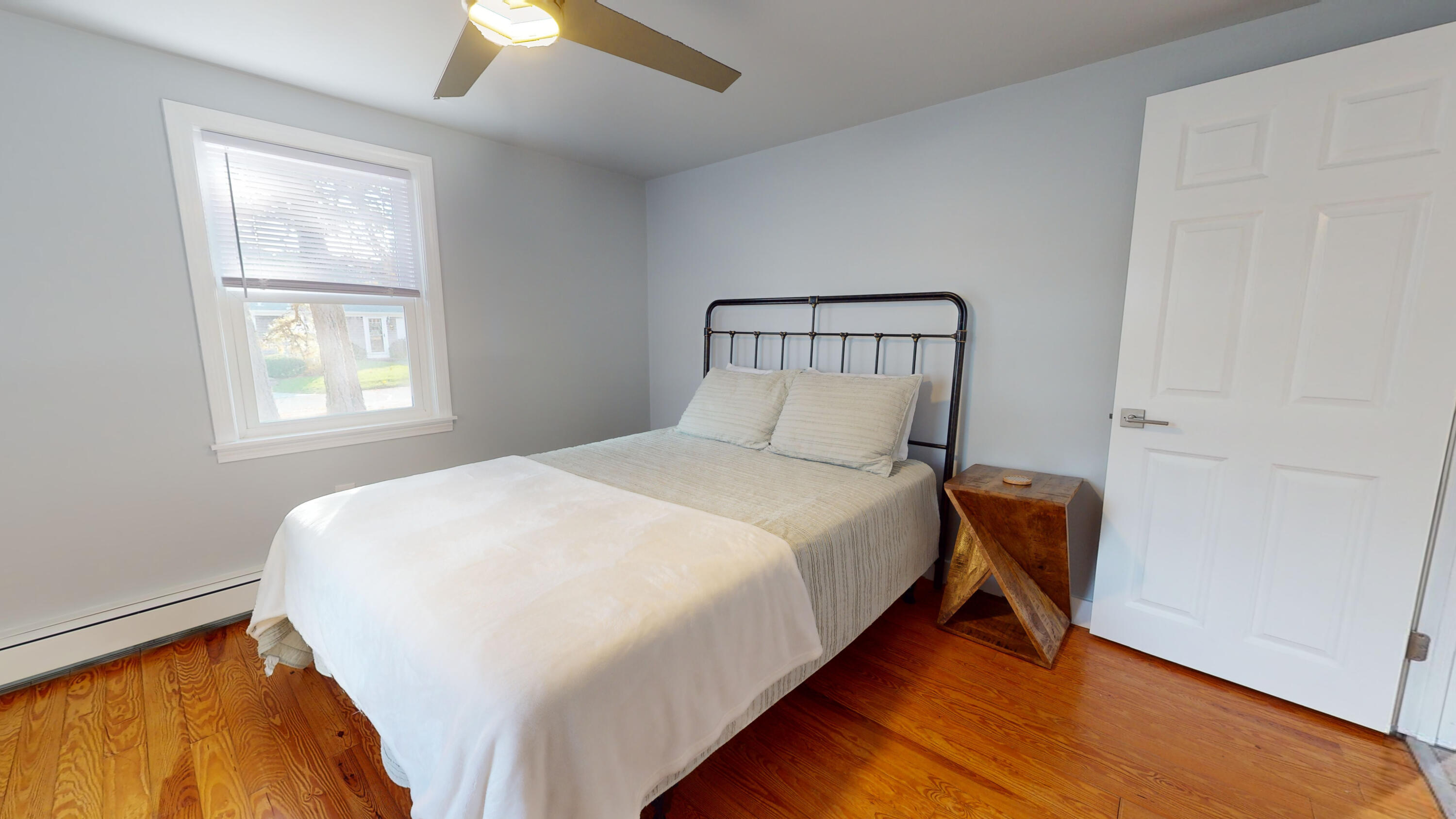 27 Wixon Road Dennis Port, MA 02639 - Photo 18 of 29 a bed sitting in a bedroom next to a window