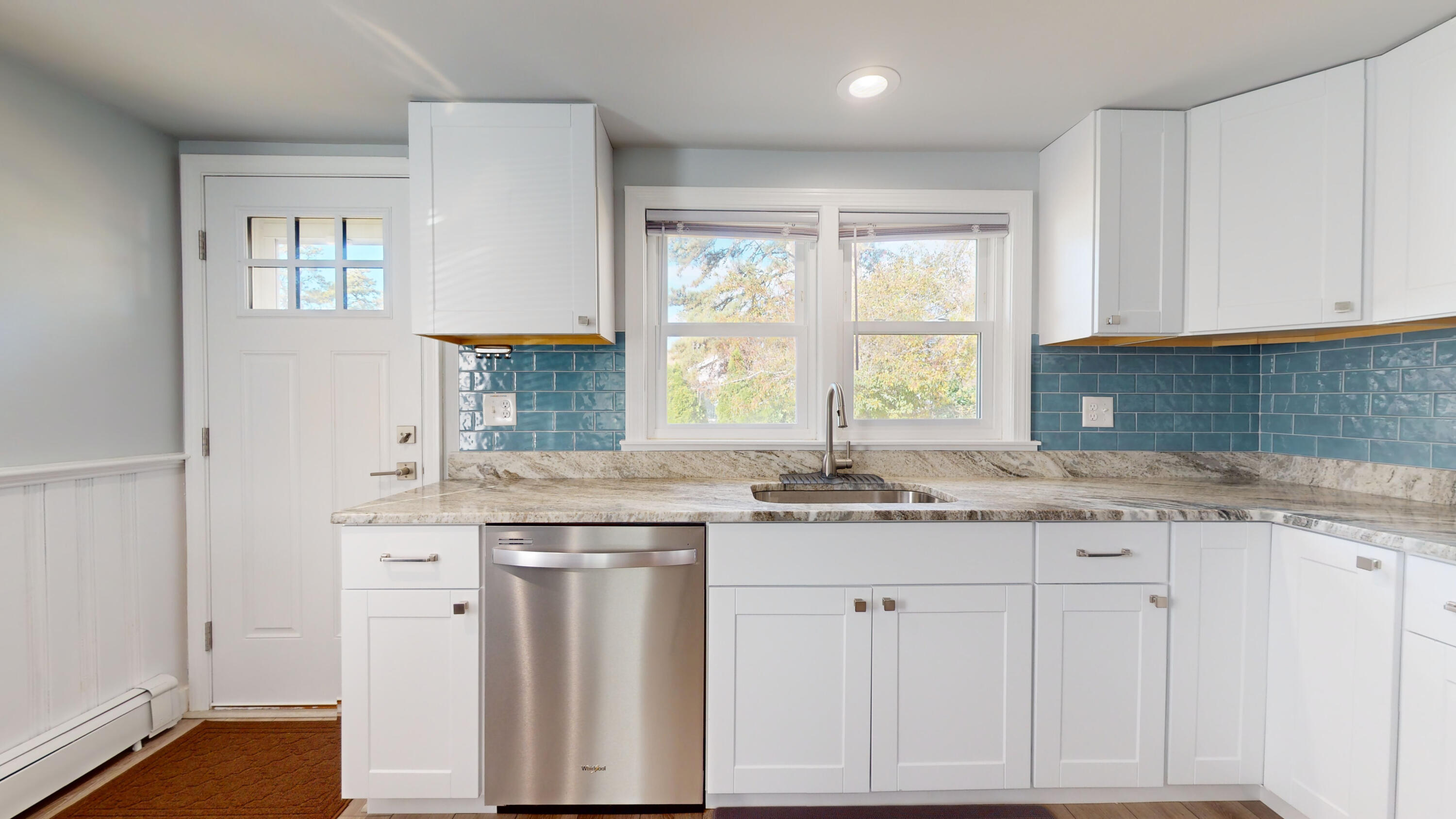 27 Wixon Road Dennis Port, MA 02639 - Photo 25 of 29 a kitchen with granite countertop white cabinets and a sink