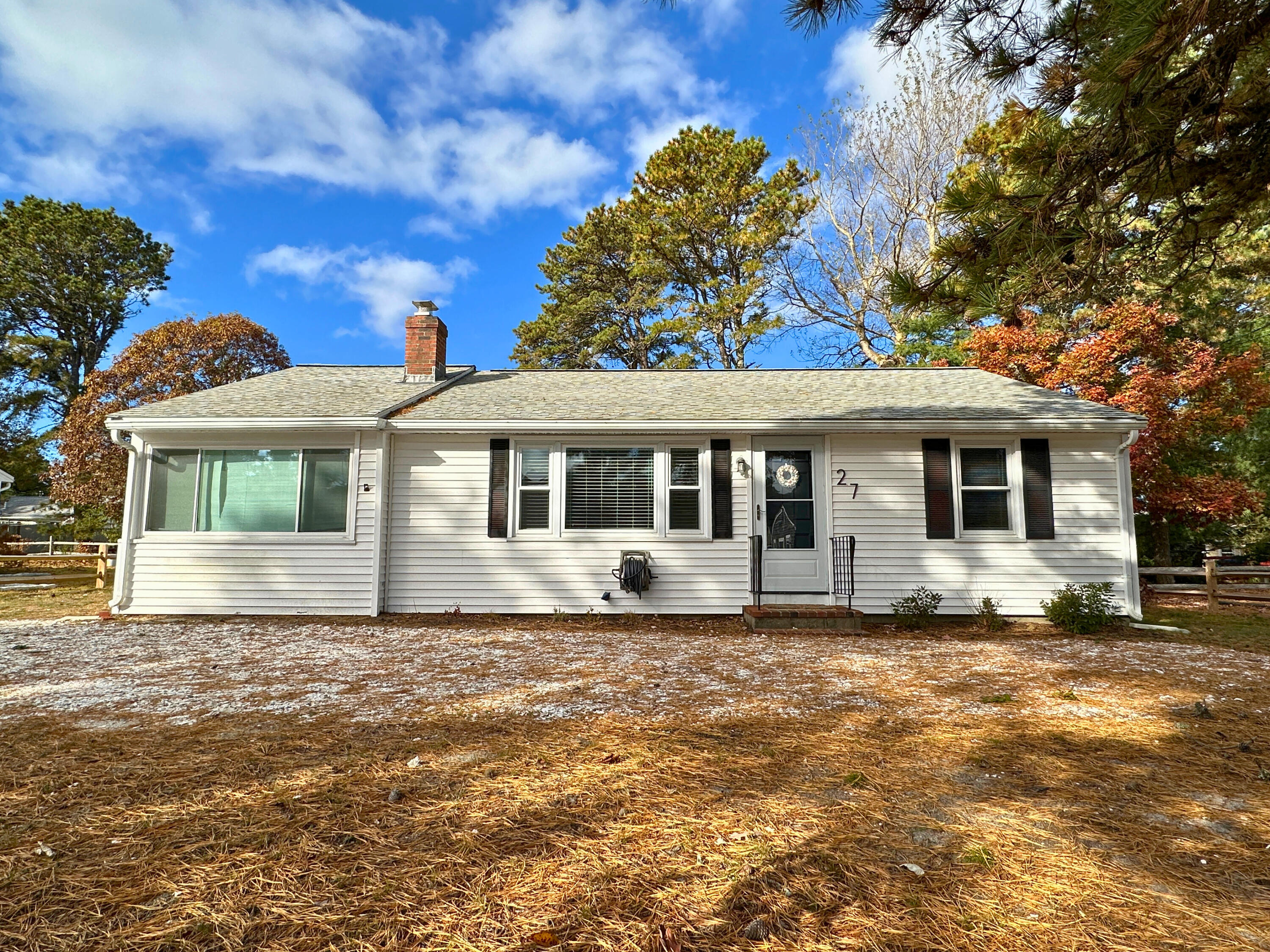 27 Wixon Road Dennis Port, MA 02639 - Photo 4 of 29 a front view of a house with a garden