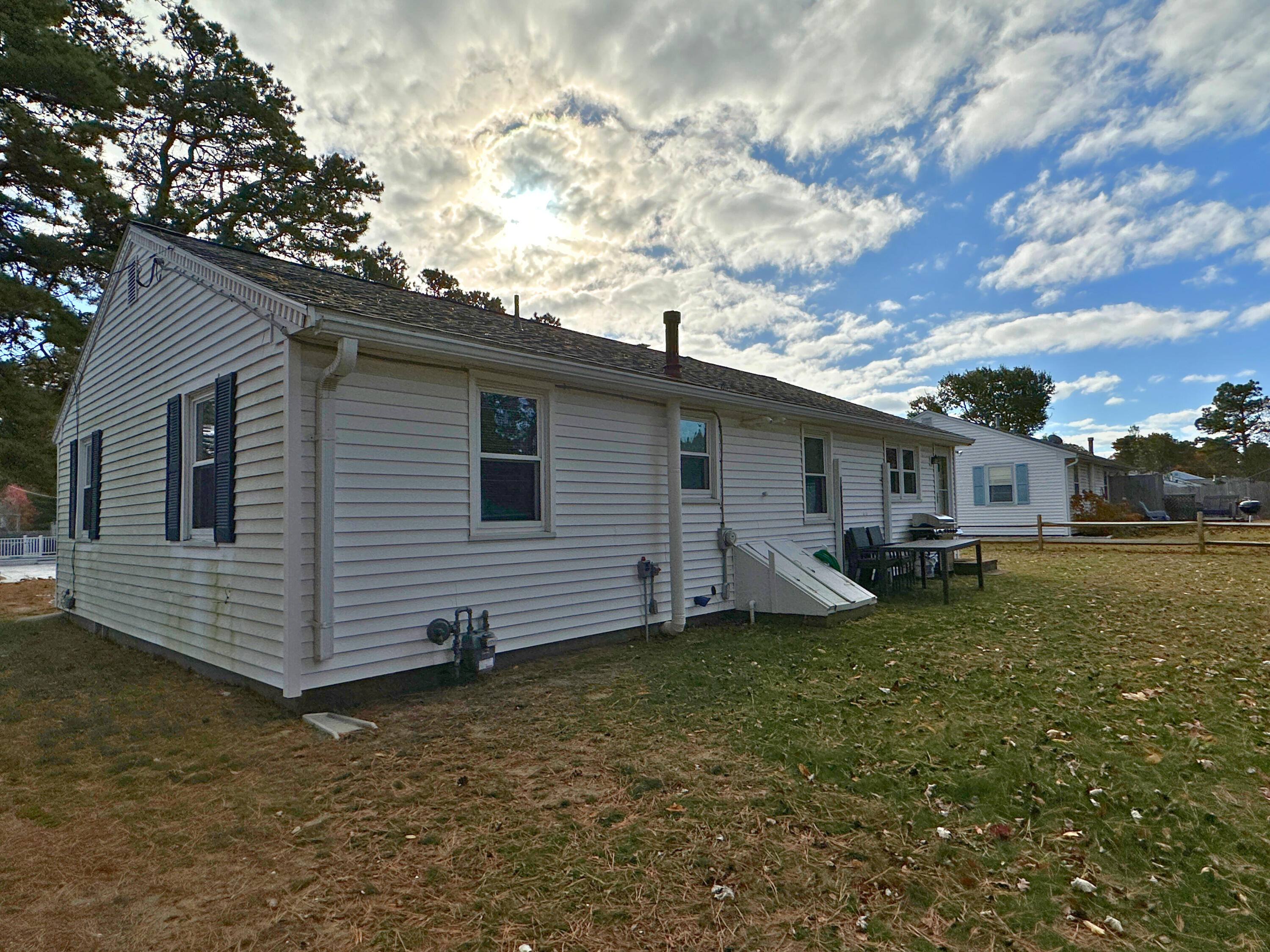 27 Wixon Road Dennis Port, MA 02639 - Photo 8 of 29 a view of a house with a yard